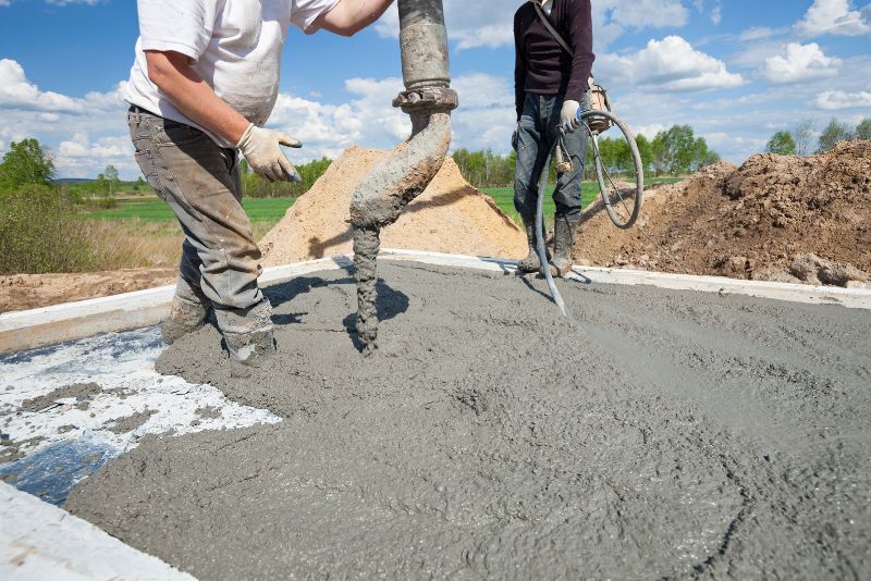 Concrete being poured and finished